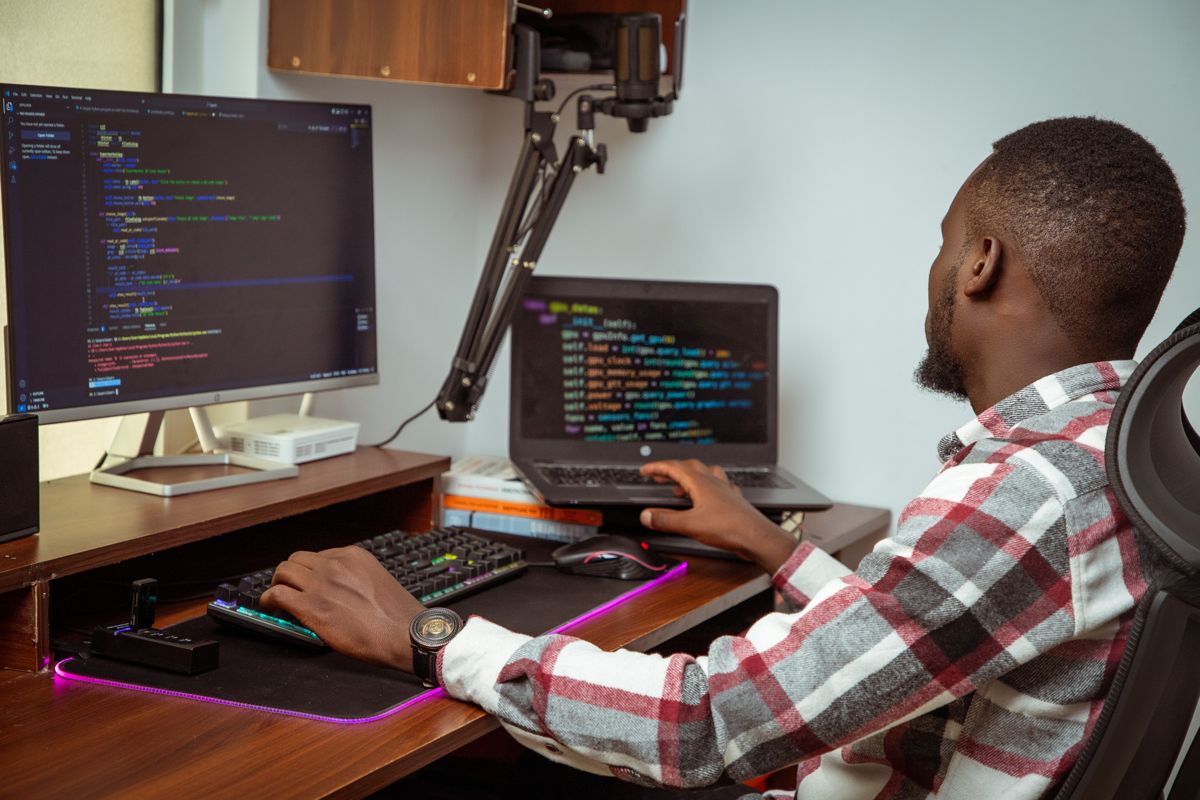 IT professional managing customer workspaces on a computer